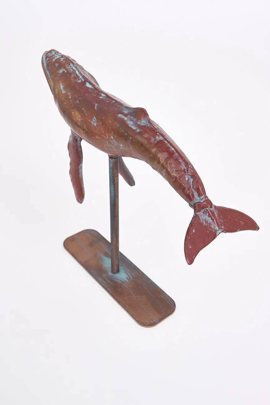 Small decorative humpback whale with a metal base