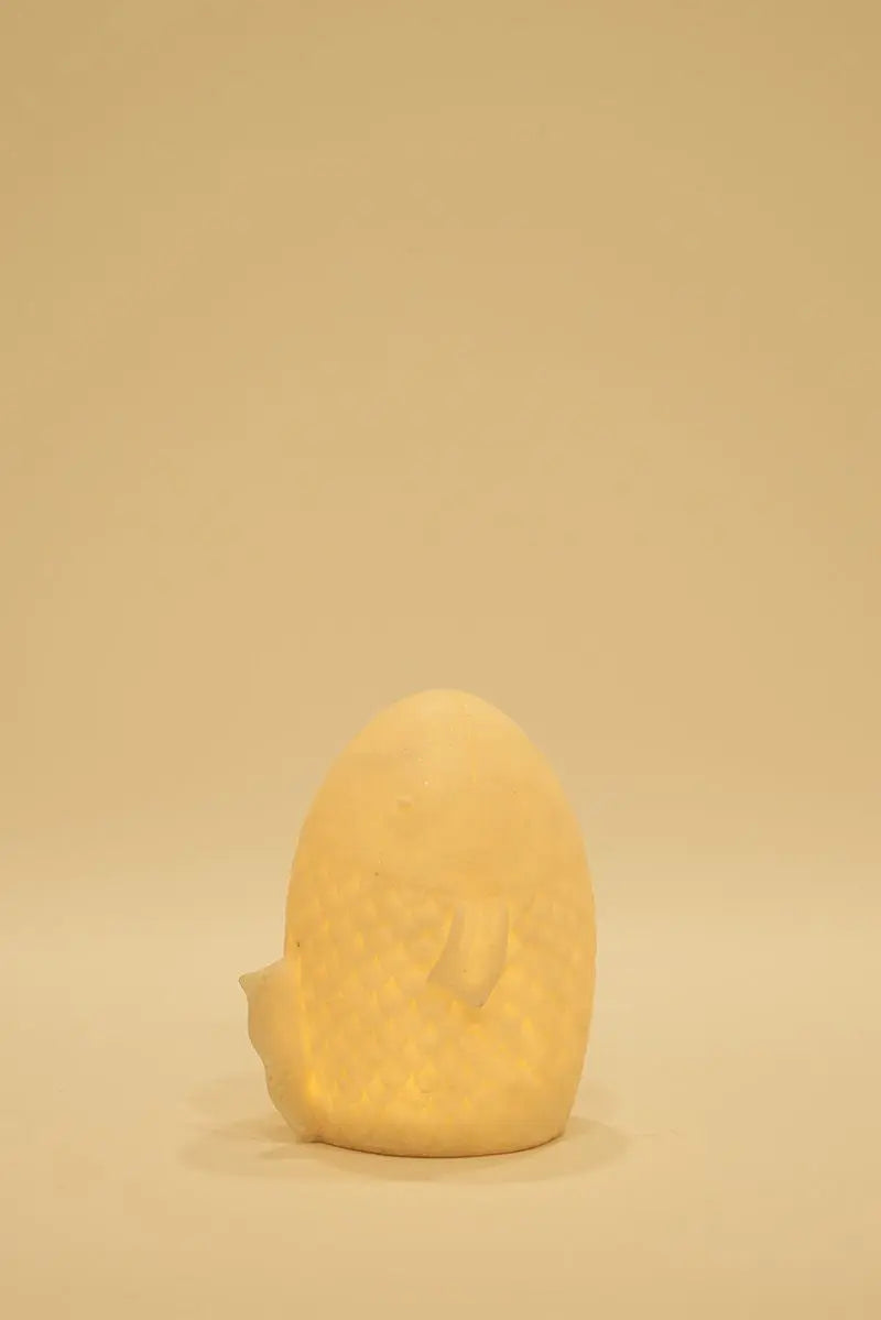 Fish-shaped resin lamp.