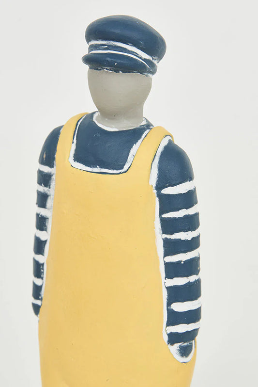 Cement sailor figurine with bib and blue hat